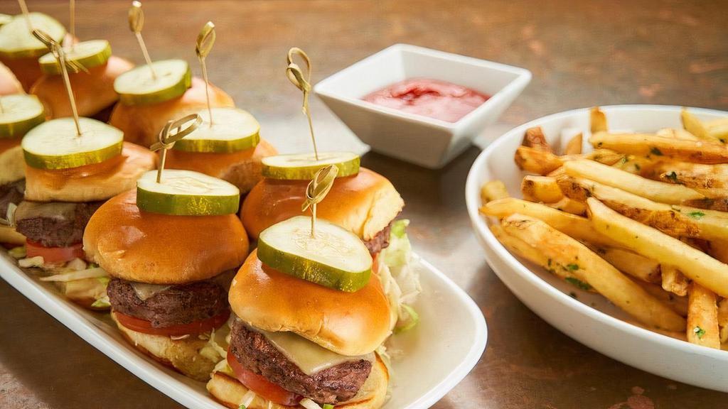 Cheeseburger Sliders · Aged white cheddar, lettuce, dill pickle, vine-ripened tomato, toasted brioche bun.. 12 mini sandwiches.. Served with fries or side salad.. Carry out only. Serves 4-6.
