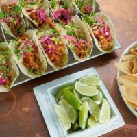 Chicken Tinga Tacos · House-smoked SPICY pulled chicken, avocado mash, pickled red onion, grilled corn, micro cila...