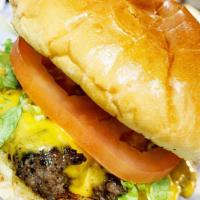 Cheeseburger · Burger, American cheese, lettuce, tomato, pickle and onion on a toasted brioche bun.