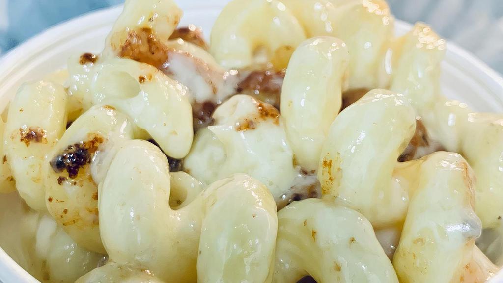 Mac And Cheese · White cheddar with cavatappi pasta.