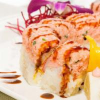 #69. Pink Dragon · Deep fried crab meat, topped w. tobiko, shrimp, crab and onion w. soybean paper.