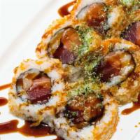 #73. Tokyo Roll · Tuna, salmon, yellow tail, fish egg and crunchy tempura.