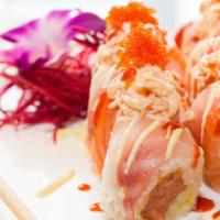 #65. Ichiban Roll · Spicy tuna w. soy bean paper top w. salmon red snapper spicy crab meat and fish egg.