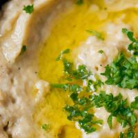 Baba Ghanoush · A blend of ground charcoal roasted eggplant with tahini sauce, seasoned lightly with garlic ...