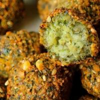 Falafel (7 Pieces) · Ground chickpeas, parsley, onions and a blend of spices shaped into tasty patties and deep f...