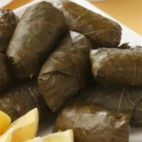 Stuffed Grape Leaves (4 Pieces) · Three grape leaves stuffed with rice, chopped parsley, onion, tomatoes, bell pepper and a bl...