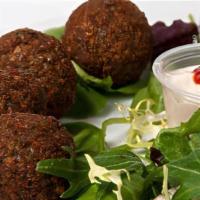 Falafel Plate · Falafel twelve pieces hummus and salad (tomatoes, onions, pickled, and cucumber) with tahini...