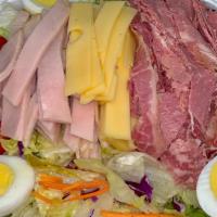 The Bb Salad · Crisp lettuce topped with corned beef, turkey, swiss cheese, hard boiled egg, and choice of ...