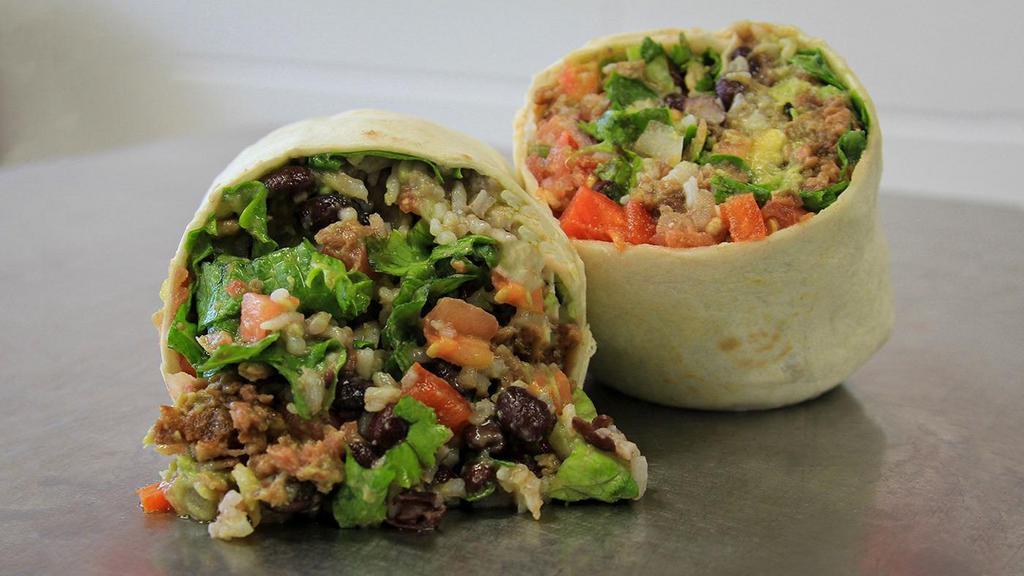 Beyond Burrito · The ultimate vegan experience! This burrito has rice, beyond meat (vegan), black beans, guacamole, mild salsa, red peppers, cilantro, and lettuce