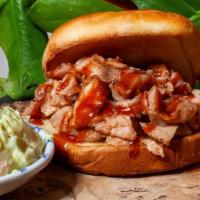 Pulled Smoked Bbq Chicken · Pulled Smoked BBQ chicken topped with island slaw on a brioche bun with choice of side, and ...