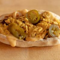 Nacho Coney · Hot Dog topped with Carl's Famous Chili, Nacho Cheese, Nacho Chips and Jalapeño.