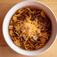 Frito Chili Pie · Fritos topped with Carl's Famous Chili, Shredded Cheddar Cheese and Onions.