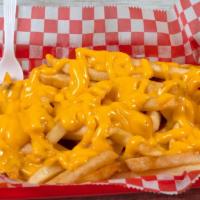Cheese Fries · Creamy cheese drizzled over golden french fries.