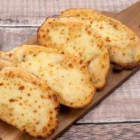 Garlic Bread With Cheese · Freshly baked garlic bread topped with creamy cheese.