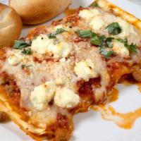 Beef Lasagna · Traditional lasagna with layers of ground beef, prosciuto, and bolognese sauce with parmesan...