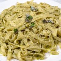Fettuccine Al Pesto · Fresh fettuccine pasta prepared with garlic, basil, and topped with freshly grated parmesan ...