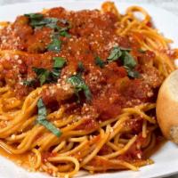 Spaghetti Bolognese · Minced meat stewed in a savory marinara sauce, served over fresh spaghetti noodles with a si...