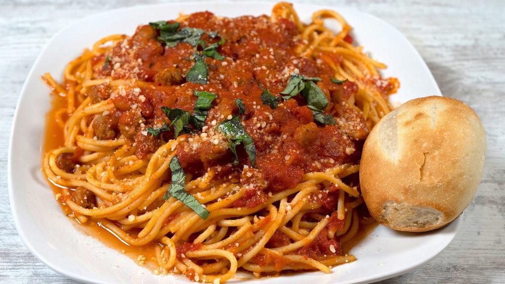 Spaghetti Bolognese · Minced meat stewed in a savory marinara sauce, served over fresh spaghetti noodles with a side of french bread.