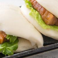 Cha Shu Bun · Steamed bun, with pork belly, lettuce, cucumber, and bun sauce