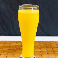 Mango Lassi · Mango lassi is a drink made with yogurt and mango pulp, sugar and cardamoms.