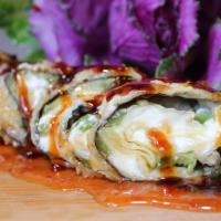 Jalapenos Crab Rangoon Roll · Our famous Crab Rangoon and jalapenos tempura with sweet & sour and brown sauce on top.