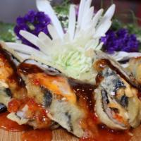 East Roll · (Tempura Roll & Cooked) Spicy tuna and american cheese served with sweet & sour sauce and br...