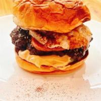 Musubi Smash Burger · two 4oz furikake seared smash patties, crispy spam, tobasco aioli, fried egg, smoked provolone