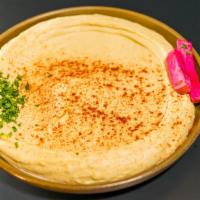 Hummus · Vegetarian. Mashed chickpeas mixed with tahini sauce.