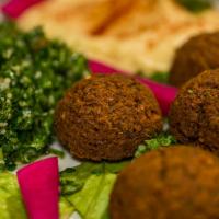 Falafel Plate · Vegetarian. 5 Pcs of perfectly fried patties made of mixed fava beans and chickpeas. Served ...