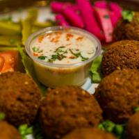 Falafel Appetizer · Vegetarian. 10 Pcs of perfectly fried patties made of mixed fava beans and chickpeas. Served...