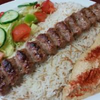 Lula Kabob Plate · Seasoned ground beef grilled to perfection. Includes rice, salad, hummus and pita bread (hal...
