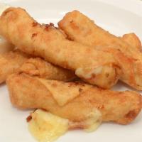 Bronx Cheese Sticks · Hand rolled mozzarella in wonton wrapper and fried to golden brown comes with one ranch dres...