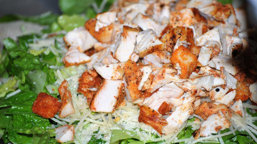 Chicken Caesar Salad · Romaine, grilled chicken breast, Parmesan cheese, croutons, and our Caesar dressing.