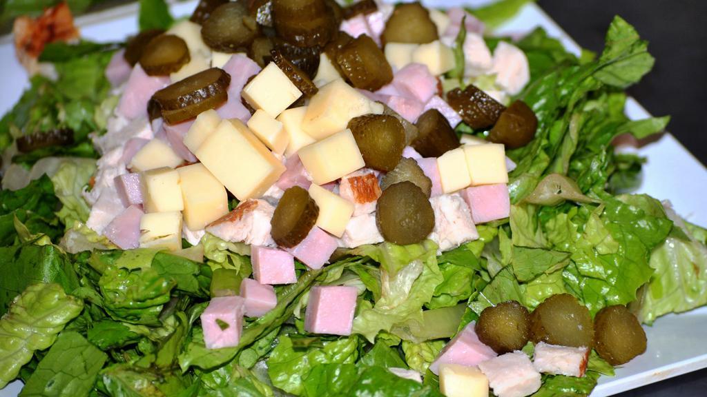 Maurice Salad · Romaine, United Deli ham, turkey, Swiss cheese sliced sweet pickles, and our Maurice dressing.