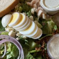 Cobb Salad · Romaine, oven-roasted turkey, Roma tomatoes, red onions, bacon, hard-boiled egg, crumbled bl...