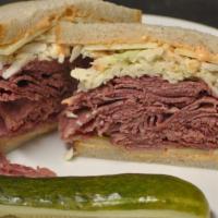 Big Mouth Corned Beef · Sy Ginsberg corned beef, Swiss cheese, coleslaw, and Russian dressing on double-baked rye.