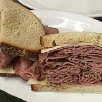 2 1/2. Pastrami Supreme · Pastrami, Swiss cheese, and Spicy mustard on double-baked rye.