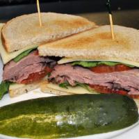 Roast Beef-N-Swiss · Rare roast beef, Swiss cheese, romaine, Roma tomatoes, and spicy mustard served on double-ba...