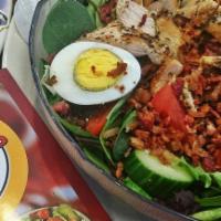 Cobb Salad · Spring mix, tomatoes, cucumber, avocado, egg, bacon, crumbled bleu cheese, grilled chicken.