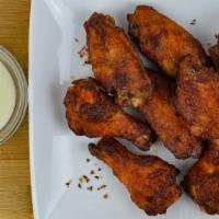 Wings · Eight traditional or 10 boneless, plain, hot, or BBQ.