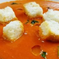 Tomato Bisque · Rich, creamy, and delicious, bursting with the flavors of tomato and basil. Served with hous...