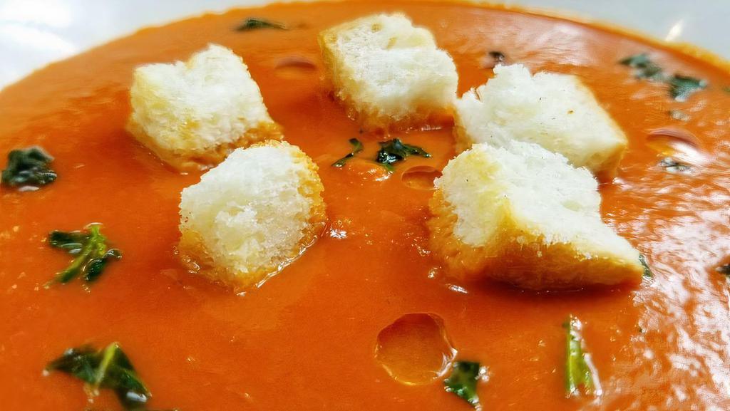 Tomato Bisque · Rich, creamy, and delicious, bursting with the flavors of tomato and basil. Served with house-made toasted croutons.