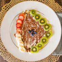 Fruity Crepe · Crepe filled with (strawberry and banana ) topped with three different Belgian chocolate (Nu...