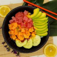 Spicy Tuna And Salmon Combo Poke Bowl · Sushi rice, antibiotics free salmon, tuna, avocado, cucumber, corn, spicy mayonnaise and una...
