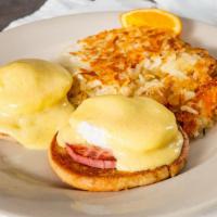 Eggs Benedict · Two poached eggs on English muffin with Canadian bacon topped with hollandaise sauce.