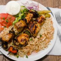 Chicken Kabob Over Rice · Charbroiled chicken chunks served over a bed of rice with a side of garlic.