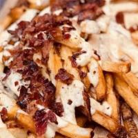 Queso Flamme Fries · Fresh hand-cut fries topped with homemade queso and bacon.