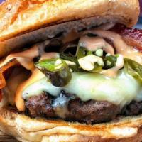 Flamme Burger · Roasted Serrano Peppers, Gruyere Cheese, Applewood Smoked Bacon, Flamme Sauce. Four-Time Ind...