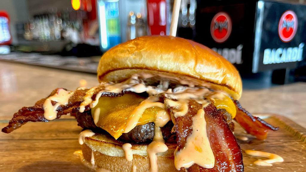 Bacon Cheddar Burger · Topped with Applewood-Smoked Bacon, Sharp Cheddar, and Chipotle Mayo.