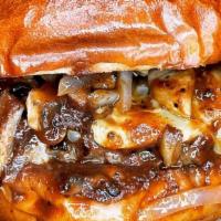 Bourbon Burger · Onions and Mushrooms Sauteed in Bourbon Sauce, Topped with Jalapeno Jack Cheese.